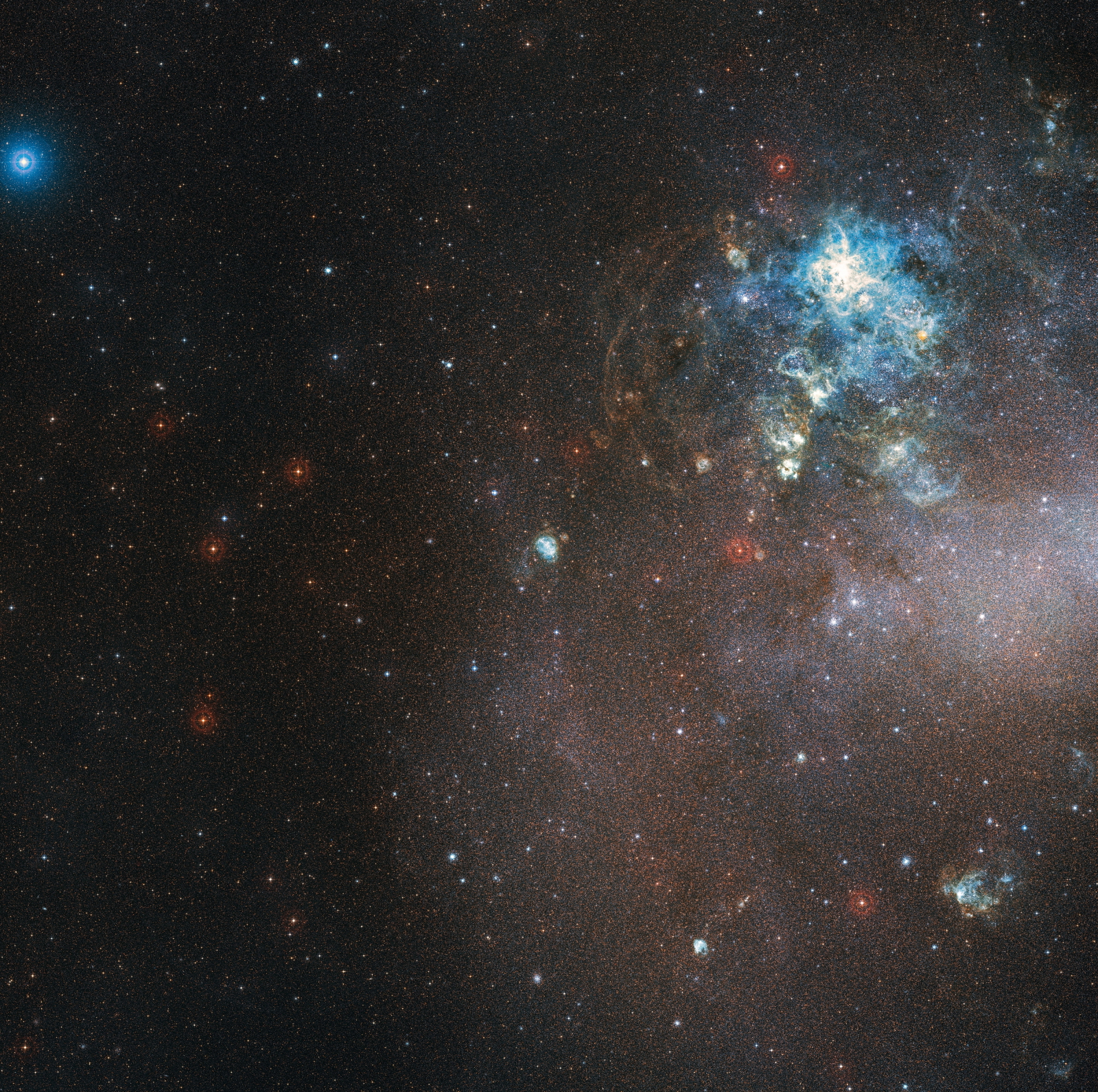 Zdjęcie wykonane przez Europejskie Obserwatorium Południowe pokazuje olśniewający obszar nowo tworzących się gwiazd w Wielkim Obłoku Magellana. Fot. PAP/EPA/ESO/Digitized Sky Survey 2 / HANDOUT